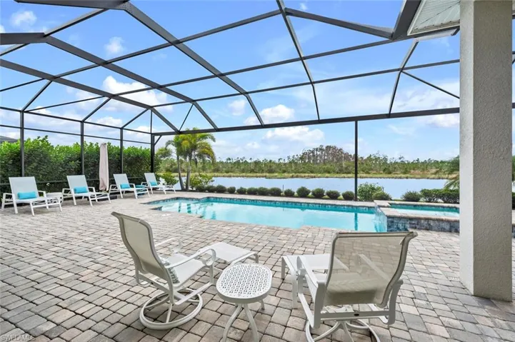 View of heated salt water pool w/spa, and amzing canal views.