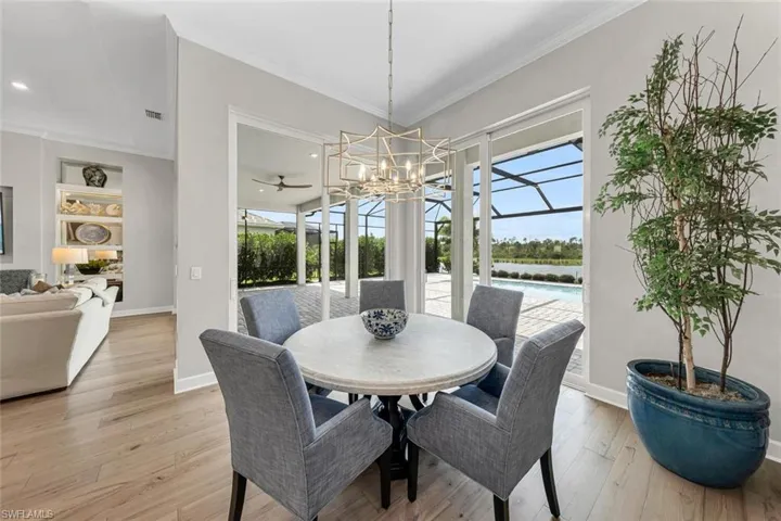 Informal dining/breakfast area overlooking lanai and pool.