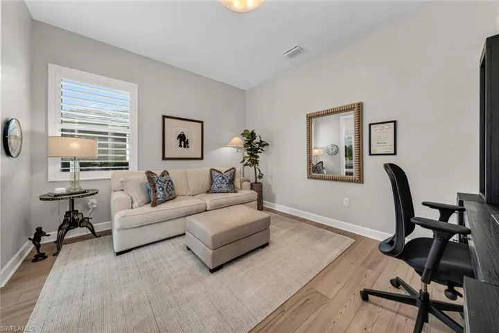 Office or 4th bedroom with plantation style blinds.