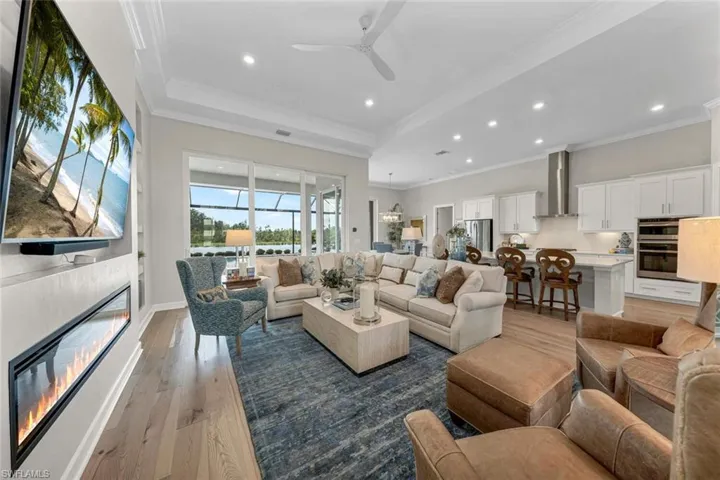 Custom crafted built-ins surrounding retangular designed electric fireplace.