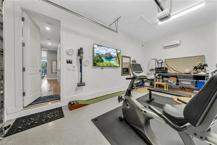 Sellers converted the 3rd car garage bay to an air conditioned workout room. Will be converted back to a garage space prior to closing.