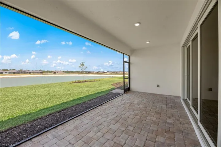 Unfurnished sunroom with a water view