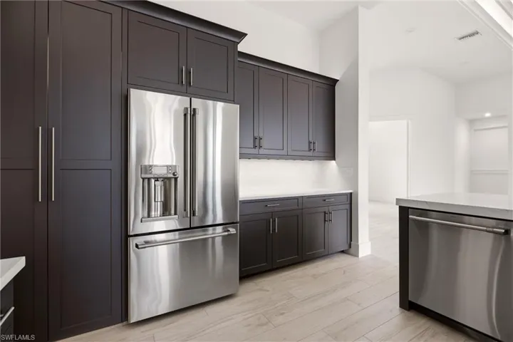 Kitchen featuring stainless steel appliances and light Tile finished floors