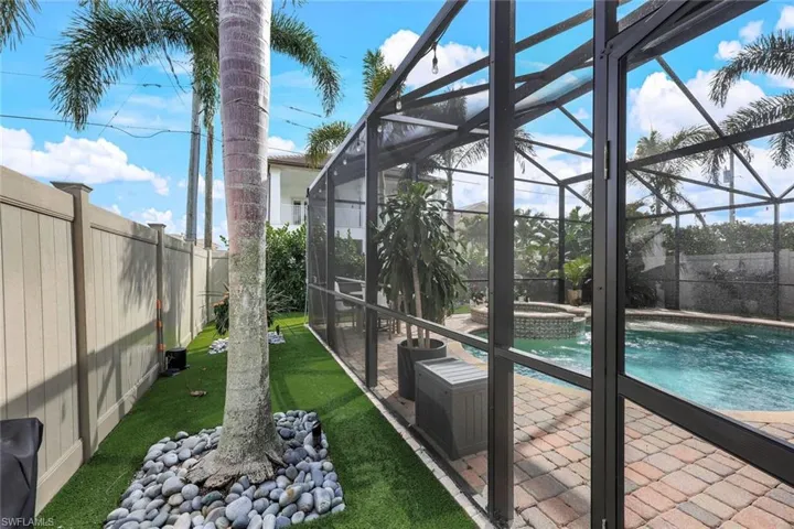 "Forever Grass" around the whole perimeter of the Pool Cage.