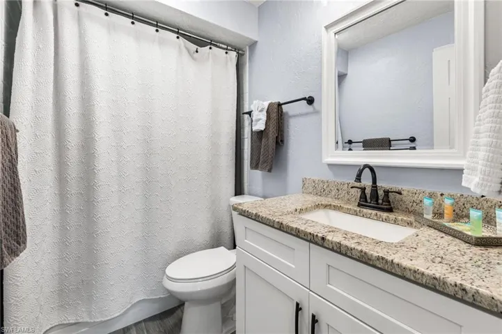 Bathroom featuring toilet and vanity