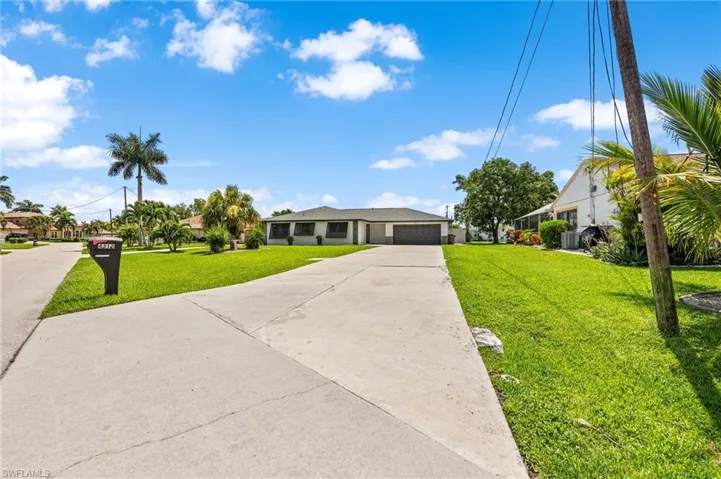 Ranch-style home featuring a front yard