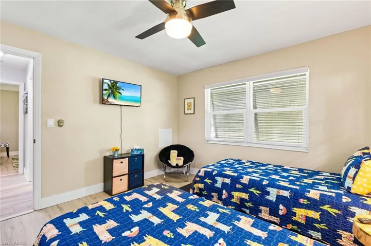 Bedroom featuring hardwood / wood-style floors and ceiling fan