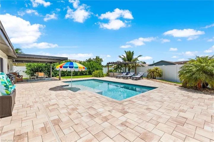 View of swimming pool with a patio area