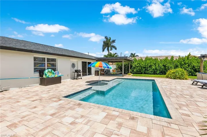View of swimming pool with a patio