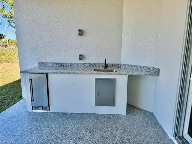 With Outdoor Kitchen