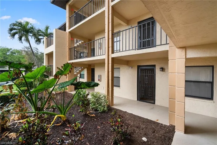 Entrance to property featuring a patio and a balcony