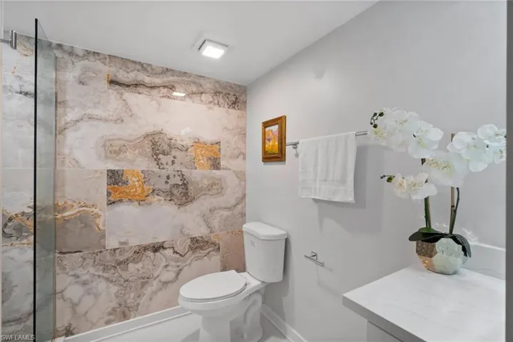 Bathroom featuring tile patterned flooring and toilet