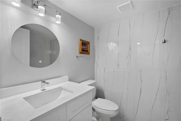 Bathroom featuring vanity and toilet