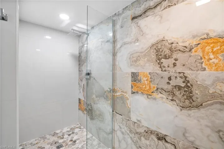 Bathroom featuring tiled shower