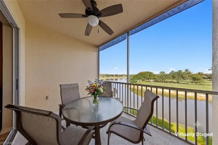 Screened balcony featuring a ceiling fan, sliding glass door access, and painted concrete flooring