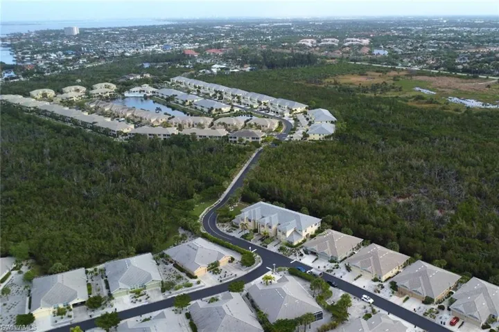 Aerial overview of property's location featuring nearby suburban area