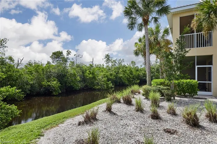 View of yard with a water view