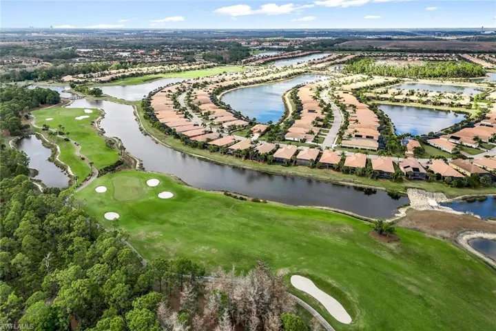 Aerial view of property's location featuring nearby suburban area and a golf club