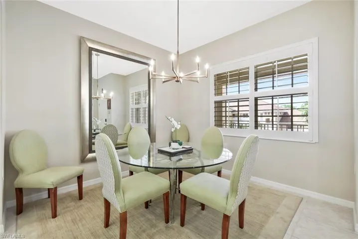 Dining area featuring suspended lighting and baseboards