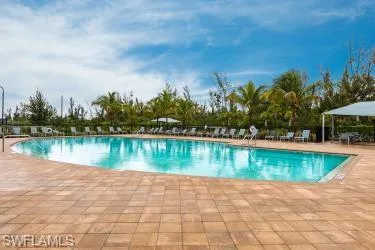 Community pool with a patio area