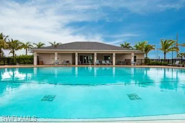 Community pool featuring a patio