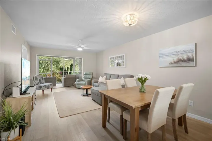 Dining space featuring light wood-type flooring and ceiling fan