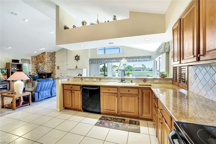Granite counters, wood cabinetry, pantry