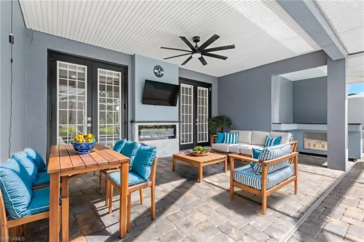 Lanai Space with fireplace and TV (virtually staged)