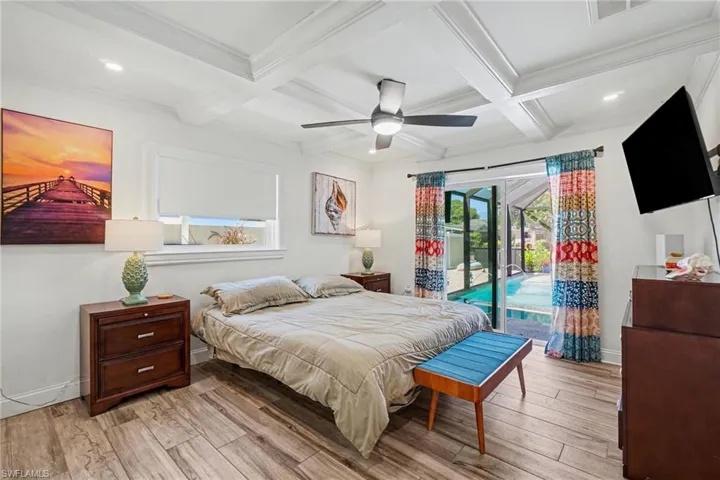 Bedroom featuring wood-finish flooring, a coffered ceiling, recessed lighting, and a ceiling fan