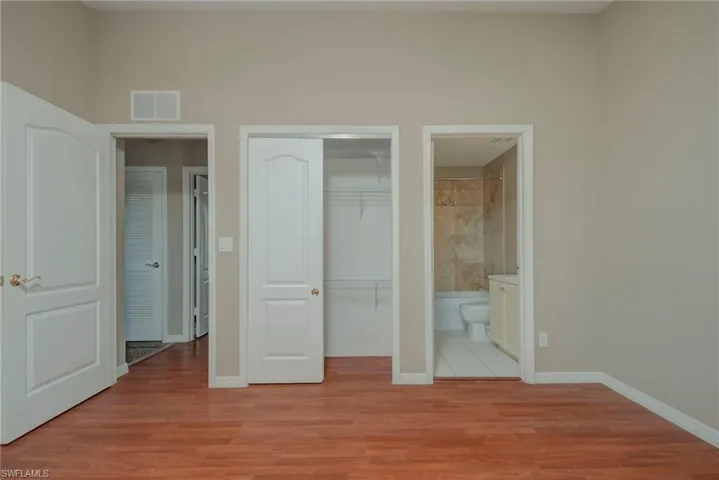 Unfurnished bedroom with light wood-style floors
