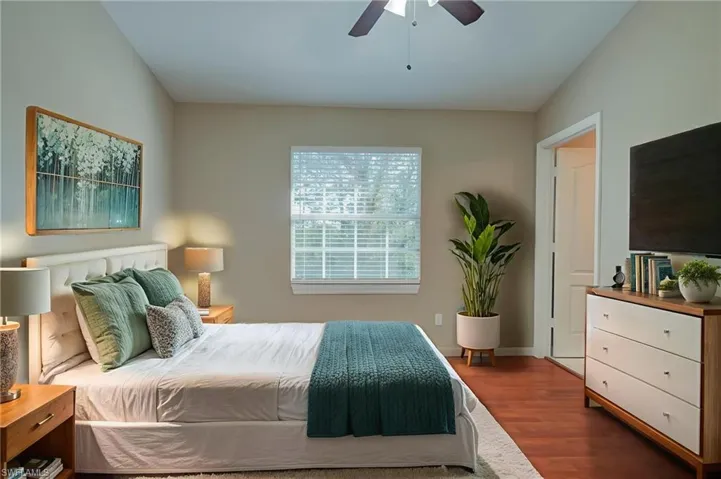 Bedroom with wood finished floors and ceiling fan