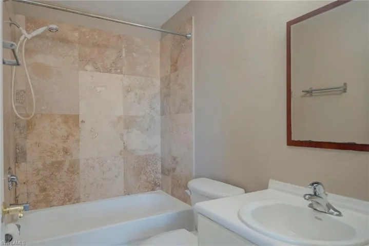 Full bath with vanity and shower / tub combination