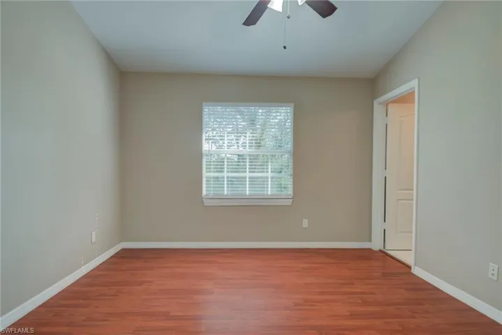Unfurnished room featuring wood finished floors and ceiling fan