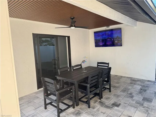 View of patio / terrace featuring a ceiling fan and outdoor dining area