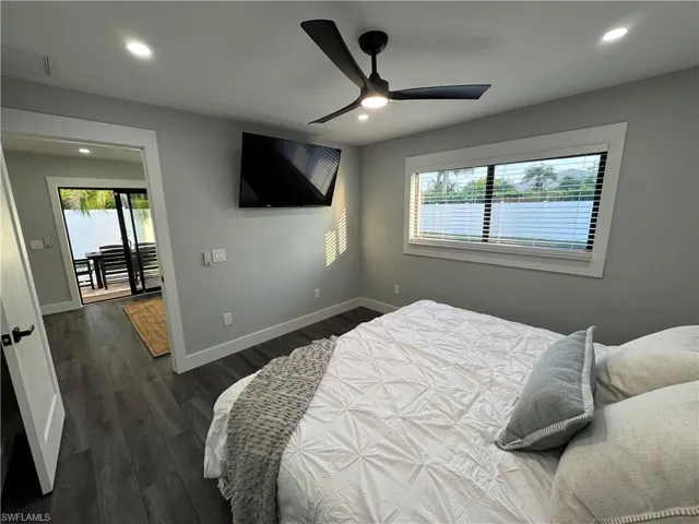 Bedroom featuring dark wood finished floors, a ceiling fan, and recessed lighting