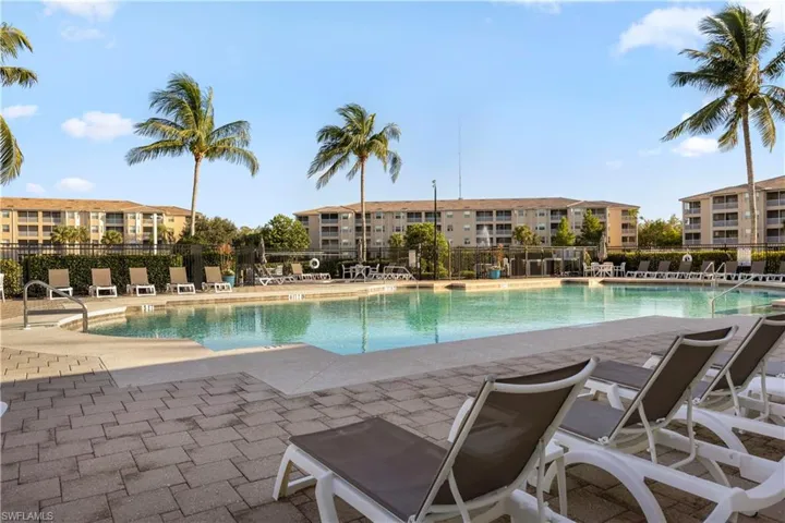 Community pool featuring a patio area