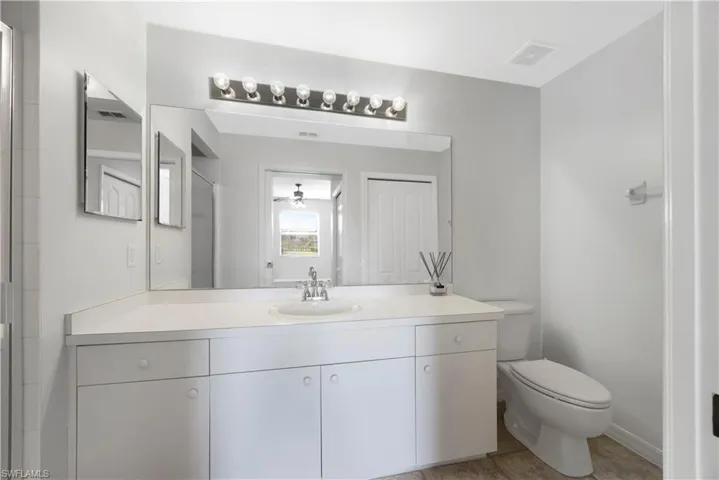 Bathroom with vanity and light tile patterned floors