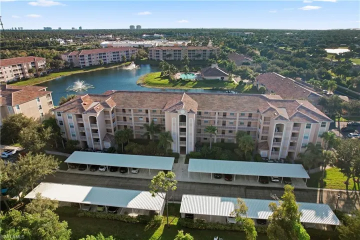 Aerial view of apartment complex and a large body of water