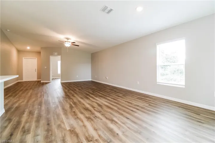 Unfurnished living room with recessed lighting, light wood finished floors, and a ceiling fan