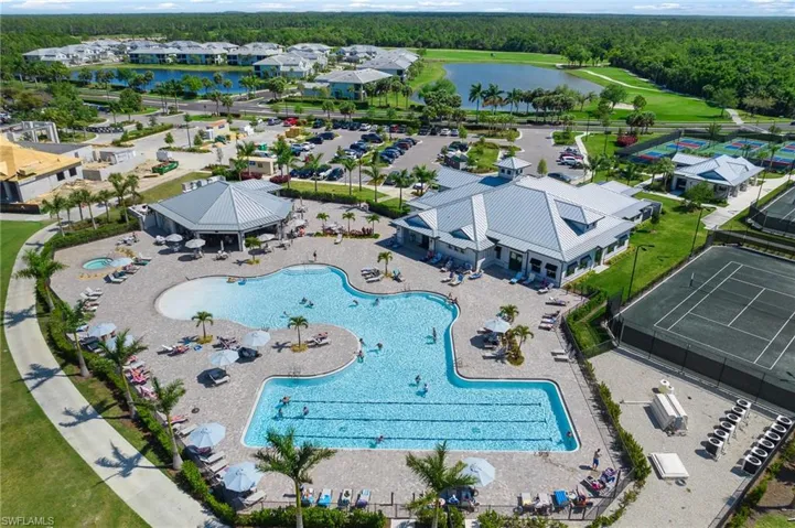 Bird's eye view of a pool area and a large body of water