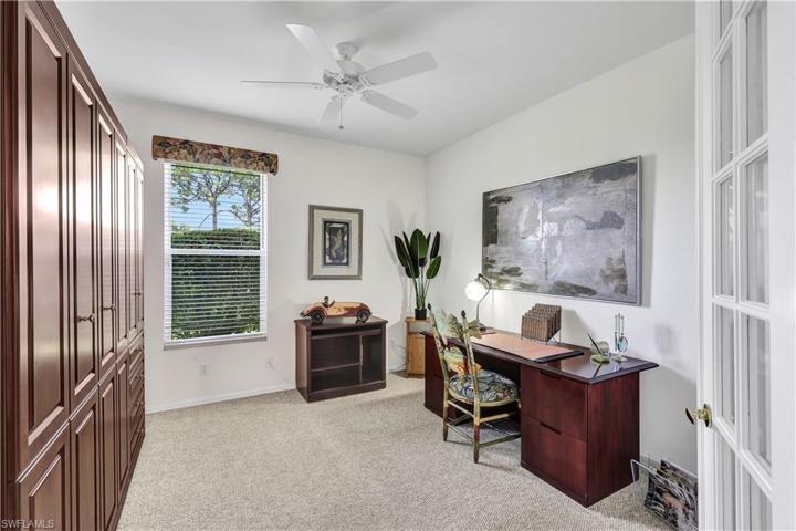 Spacious den w/ double Murphy Bed & closet cabinet plus covered double French Doors!