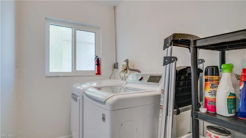 Washroom featuring separate washer and dryer