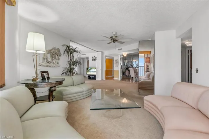 Pic taken from Living Room offering OPEN concept advantage of Den/3rd Bed with privacy retractable wall shown right side of TV.  Dining Room and Front Entry!