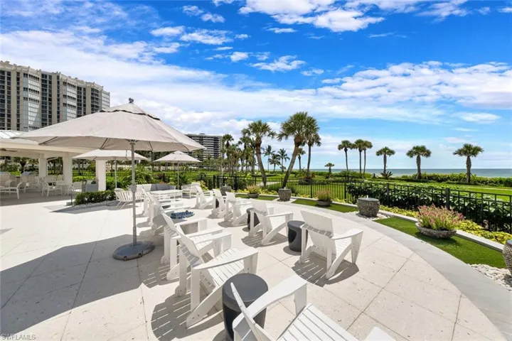 Additional Comfortable Pool Area, offers Cushioned Living Room Seating, Covered Seating with Grill and Kitchen Area, Relaxing Water Fountains, Water Views ,Direct  Sunset Views! Firepit Gatherings! Ample Seating!