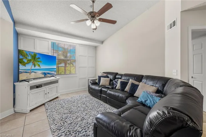 Living room fitting a huge sectional couch.