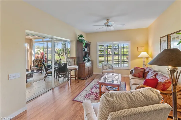 Den or you can make it a dining room featuring light wood-style floors and a ceiling fan