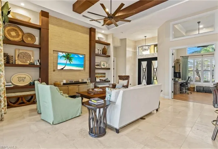 Spacious great room designed for entertaining, showcasing high ceilings, sophisticated finishes, and effortless indoor-outdoor flow.