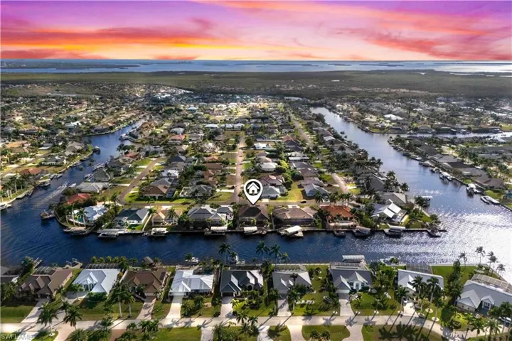 High vantage view of this gorgeous home - quiet tucked away neighborhood with large canal views and easy access out to the Gulf!