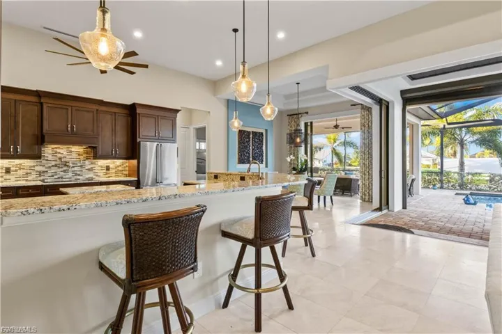 Open kitchen with natural light, high-end finishes, and easy flow into dining and living areas, perfect for entertaining.