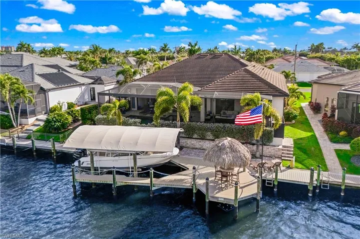 Waterfront dock and captain’s walk providing direct canal access and idyllic sunsets.